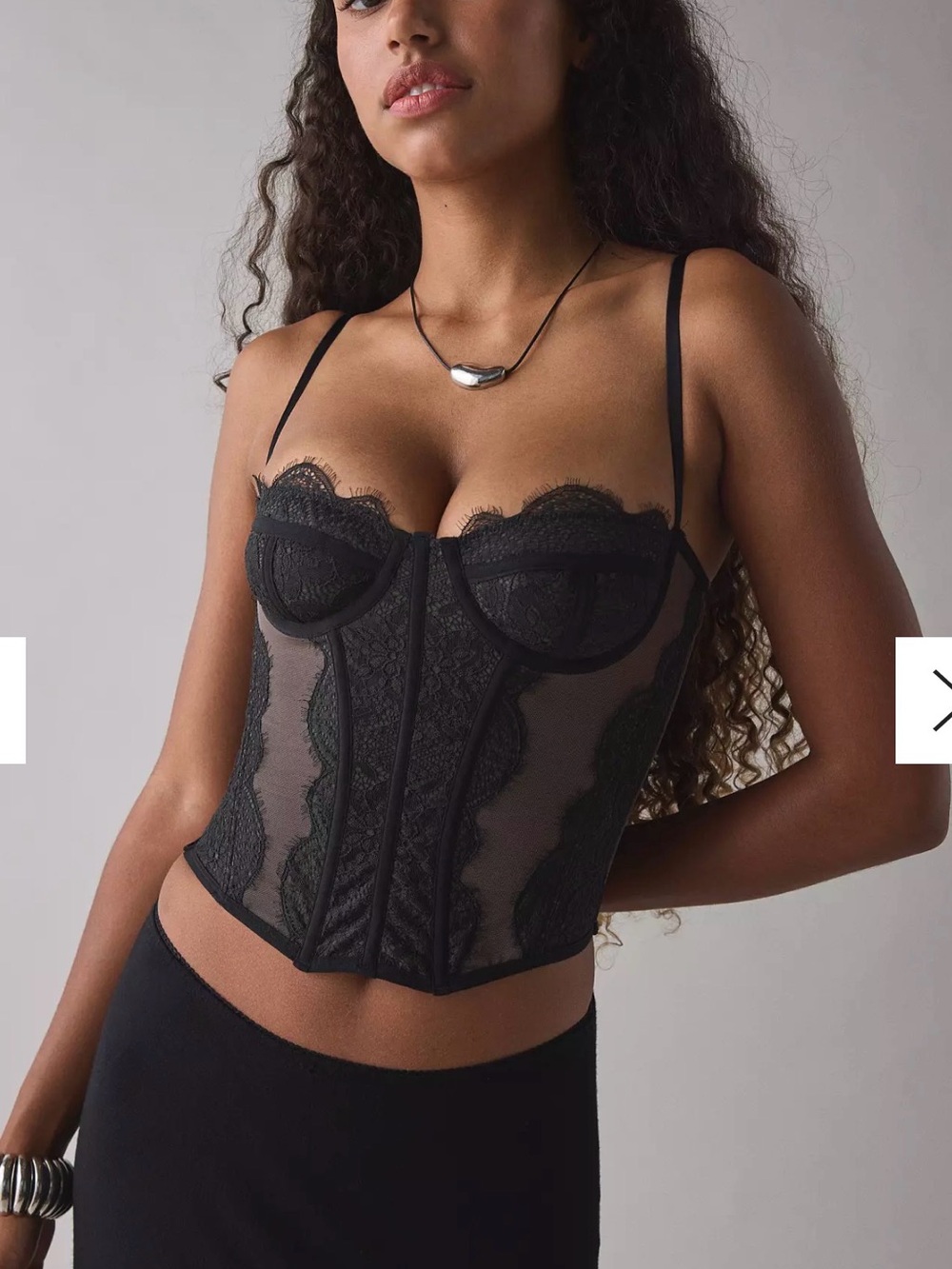Urban Outfitters black lace and mesh corset top, size small.
